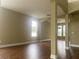Spacious living room featuring hardwood floors, neutral walls, and a large window at 2255 Stone Lake Ct, Orlando, FL 32824