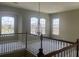 A spacious loft area offers plenty of natural light with arched windows, creating a cozy and inviting space at 2255 Stone Lake Ct, Orlando, FL 32824