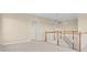 View of an upstairs loft area with white banisters and carpet at 2255 Stone Lake Ct, Orlando, FL 32824