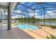 Screened-in pool with a view of the lake at 2255 Stone Lake Ct, Orlando, FL 32824