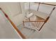 Carpeted staircase featuring white banisters with wood handrails at 2255 Stone Lake Ct, Orlando, FL 32824