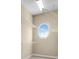 Walk-in closet with wire shelving and an oval window allowing for natural light at 2255 Stone Lake Ct, Orlando, FL 32824