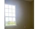This sun-filled bedroom features neutral paint and large window at 2255 Stone Lake Ct, Orlando, FL 32824