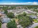 Community aerial showcasing neighborhood layout, manicured landscaping and community pool at 2493 Pine Chase Cir, St Cloud, FL 34769