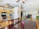 Open-concept kitchen and dining area with access to the living room at 2493 Pine Chase Cir, St Cloud, FL 34769