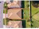 Overhead aerial view of home with large backyard surrounded by lush greenery and nearby houses at 2736 Atherton Dr, Orlando, FL 32824
