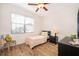 Cozy bedroom with wood-look floors, a ceiling fan, natural light and a neutral color palette at 2736 Atherton Dr, Orlando, FL 32824
