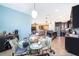 Open concept kitchen area features a breakfast table with seating for four, views to the kitchen and living room at 2736 Atherton Dr, Orlando, FL 32824