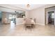 Open-concept dining room boasts tile floors and views of the living area and backyard at 2736 Atherton Dr, Orlando, FL 32824