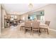 Dining room with a decorative table setting, tile flooring, and an open view of the living area at 2736 Atherton Dr, Orlando, FL 32824