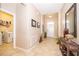 Spacious entryway with tile flooring, natural lighting and leading to the utility room with a washer and dryer at 2736 Atherton Dr, Orlando, FL 32824