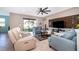 Inviting living room with tile flooring, comfortable seating, and sliding glass doors to the patio at 2736 Atherton Dr, Orlando, FL 32824