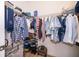 Well-organized walk-in closet with shelving for shoes, overhead storage, and hanging space for clothes at 2736 Atherton Dr, Orlando, FL 32824