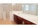 Bathroom showcasing a double sink vanity and glass-enclosed shower at 2750 Eagle Lake Dr, Clermont, FL 34711