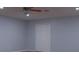 Bedroom showcasing a ceiling fan with light fixture and double door closet at 2750 Eagle Lake Dr, Clermont, FL 34711