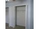 Open closet with bi-fold doors and wire shelving for organized storage at 2750 Eagle Lake Dr, Clermont, FL 34711