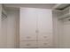 Organized walk-in closet with built-in storage and drawers at 2750 Eagle Lake Dr, Clermont, FL 34711
