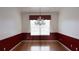 Elegant dining room with hardwood floors and a classic chandelier at 2750 Eagle Lake Dr, Clermont, FL 34711