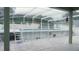 Enclosed in-ground pool with ladder access, and spacious patio area for outdoor lounging at 2750 Eagle Lake Dr, Clermont, FL 34711