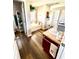 Well-lit bathroom with a soaking tub, wood-look flooring, and vanity at 3 Sunrise Dr, Ocala, FL 34472