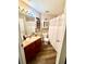 Bathroom featuring a vanity, neutral tile and a framed mirror at 3 Sunrise Dr, Ocala, FL 34472