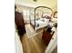 Quaint bedroom with four-poster bed, wood floors, and ample natural light at 3 Sunrise Dr, Ocala, FL 34472