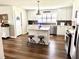 Spacious kitchen featuring white cabinetry, a center island with seating, and stainless appliances at 3 Sunrise Dr, Ocala, FL 34472