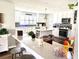 Bright kitchen boasting white cabinets, a center island with seating, and modern appliances at 3 Sunrise Dr, Ocala, FL 34472