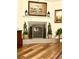 Living room featuring a decorative fireplace, mantel, and wood-look flooring at 3 Sunrise Dr, Ocala, FL 34472