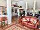 Living room showcasing dark wood floors, vaulted ceilings, and vintage-inspired accents at 3 Sunrise Dr, Ocala, FL 34472