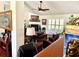 Living room showcasing a fireplace, plantation shutters, and dark wood flooring at 3 Sunrise Dr, Ocala, FL 34472
