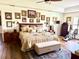 Spacious primary bedroom with beautiful decor, exercise bike, and wood-look flooring at 3 Sunrise Dr, Ocala, FL 34472
