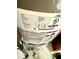 Close-up of a water heater with visible serial number, model details, and other technical specifications at 3 Sunrise Dr, Ocala, FL 34472