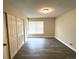 Bright bedroom featuring updated flooring, closet, neutral paint, and lots of natural light at 3 Trophy Ln, Kissimmee, FL 34759