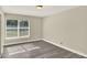 Bright bedroom featuring natural lighting, laminate flooring and neutral paint at 3 Trophy Ln, Kissimmee, FL 34759