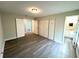 Spacious bedroom featuring wood floors and a closet, with an ensuite bath at 3 Trophy Ln, Kissimmee, FL 34759