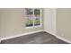 Bright bedroom with updated floors, large window, and closet space at 3 Trophy Ln, Kissimmee, FL 34759