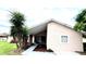 Cozy single-story home featuring a charming front yard with mature trees and a covered entrance at 3 Trophy Ln, Kissimmee, FL 34759
