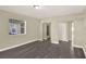 Spacious living room featuring neutral paint, dark laminate flooring and natural light at 3 Trophy Ln, Kissimmee, FL 34759
