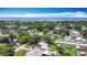 Beautiful aerial shot of the community, with green tree canopy, blue skies and open water in the distance at 301 Oregon Ave, St Cloud, FL 34769