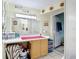 A well-lit bathroom features a vanity with ample counter space and storage, perfect for your daily routine at 301 Oregon Ave, St Cloud, FL 34769