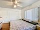 Bedroom features a ceiling fan, neutral paint and wood floors at 301 Oregon Ave, St Cloud, FL 34769