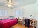 Bedroom features a ceiling fan, two windows, and a closet at 301 Oregon Ave, St Cloud, FL 34769