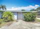 Quaint single-story home with secure entry and mature landscaping for privacy and curb appeal at 301 Oregon Ave, St Cloud, FL 34769