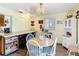 The eat-in kitchen features wood floors, lots of storage and counter space with a breakfast bar at 301 Oregon Ave, St Cloud, FL 34769