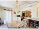 Bright kitchen features a dining area with a unique light fixture and a built in breakfast bar at 301 Oregon Ave, St Cloud, FL 34769