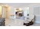 Cozy living room area with tile floors seamlessly connects to the kitchen, creating an inviting and functional space at 301 Oregon Ave, St Cloud, FL 34769