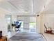 Office features a computer, workstation and natural light from the door to the backyard at 301 Oregon Ave, St Cloud, FL 34769