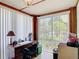 Office features natural light from large windows and wood trim at 301 Oregon Ave, St Cloud, FL 34769