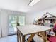 Spacious workshop has ample lighting and sliding glass doors leading to the backyard at 301 Oregon Ave, St Cloud, FL 34769